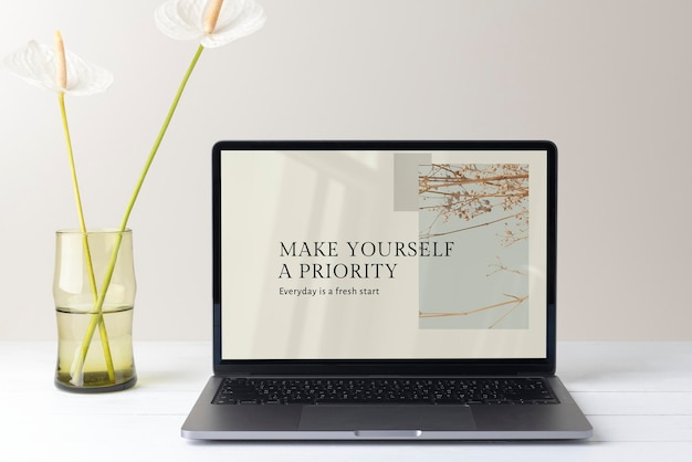 Laptop screen mockup psd minimal workspace white flower decoration