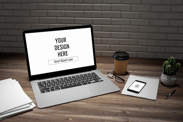 PSD laptop and smartphone on desk mockup