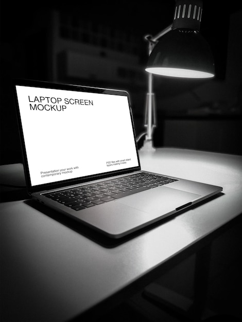 PSD laptop next to study lamp