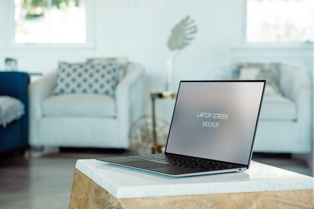 PSD laptop on top of center table mockup