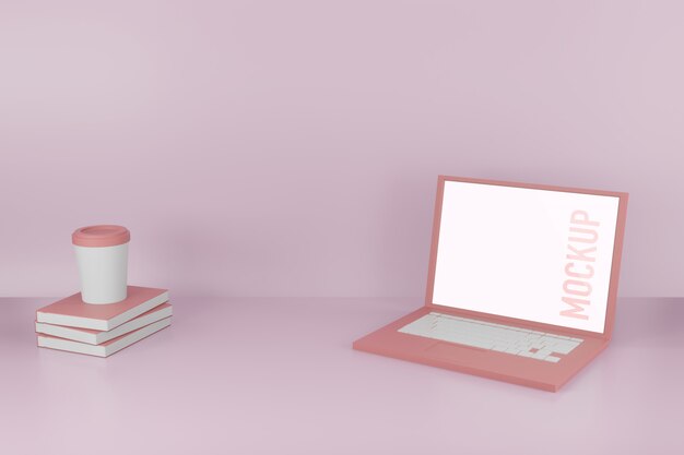 Laptop with a coffee cup on books mockup