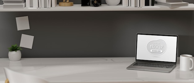 Computer portatile con schermo di mockup sul tavolo nel rendering 3d scrivania home office