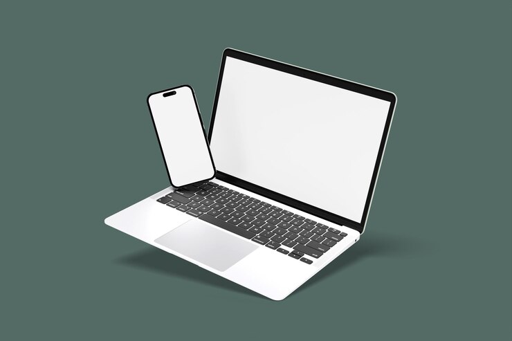 PSD a laptop with a phone on the top of it