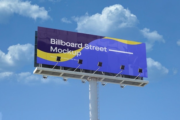 Large billboard mockup on blue sky with clouds