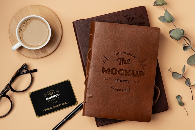 PSD leather notebook and coffee cup mockup flat lay