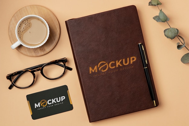 PSD leather notebook and coffee cup mockup top view