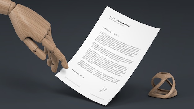 PSD letterhead mockup with wooden puppet hand