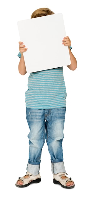 little boy holding blank paper board studio portrait