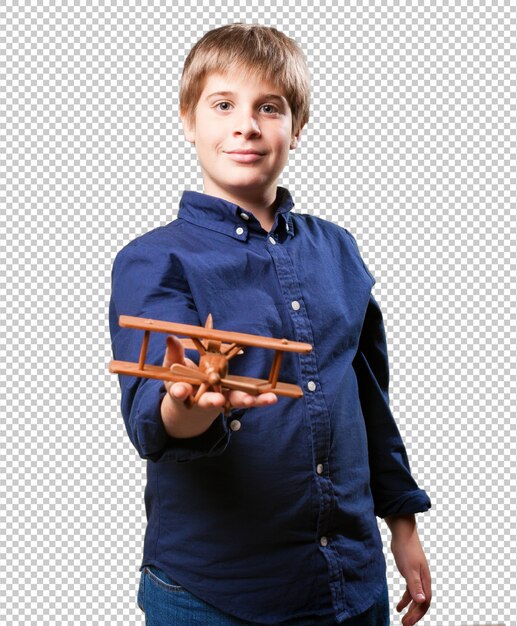 PSD little boy holding a wooden biplane toy