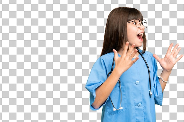 Little girl as a surgeon doctor over isolated chroma key background with surprise facial expression