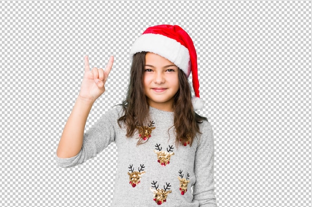 PSD little girl celebrating christmas day showing a horns gesture as a revolution concept.