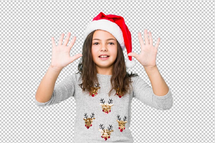 PSD little girl celebrating christmas day showing number ten with hands.