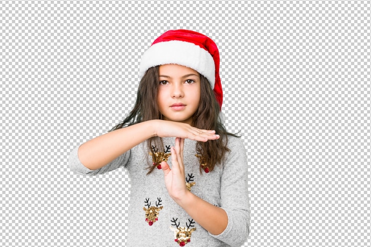 PSD little girl celebrating christmas day showing a timeout gesture.