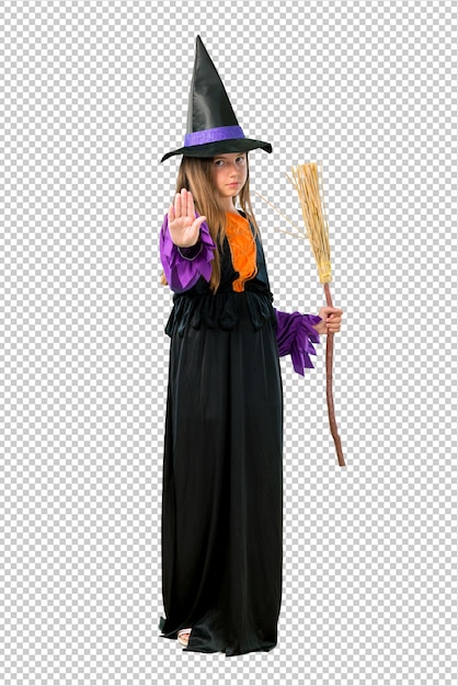 PSD little girl dressed as a witch for halloween holidays making stop gesture with her hand