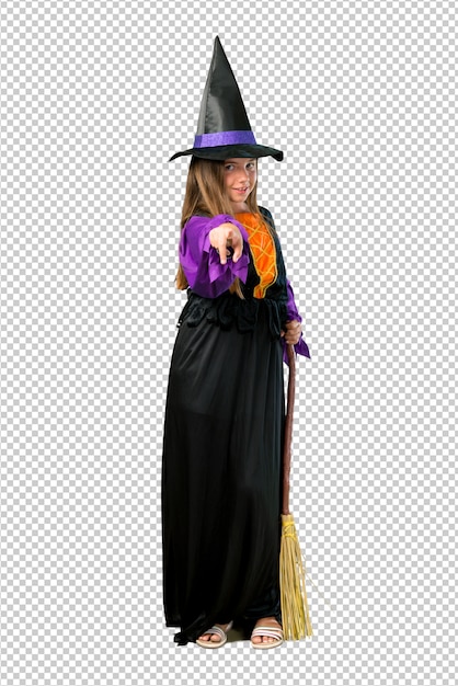 Little girl dressed as a witch for halloween holidays points finger at you