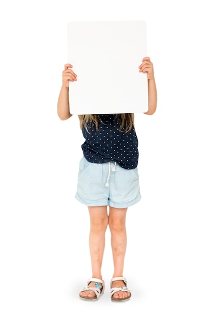 little girl holding blank placard covering her face
