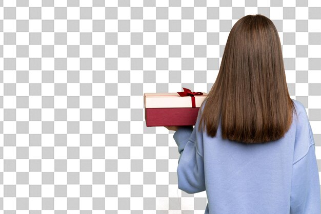 little girl holding a gift over isolated chroma key background in back position