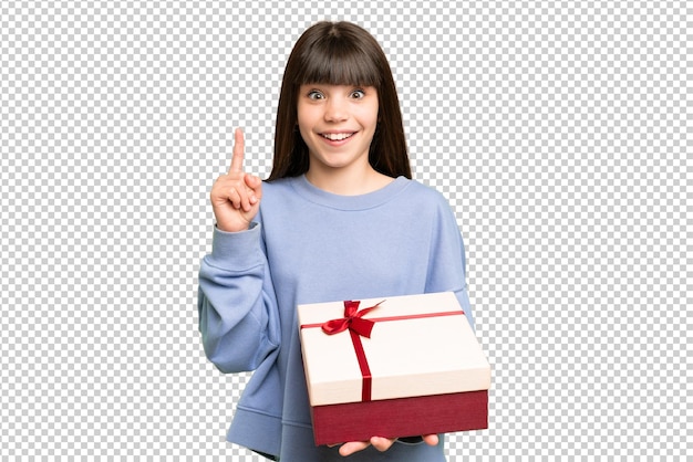 素晴らしいアイデアを指摘する孤立したクロマキー背景の上にプレゼントを持っている小さな女の子