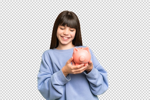 little girl holding a piggybank over isolated chroma key background with happy expression