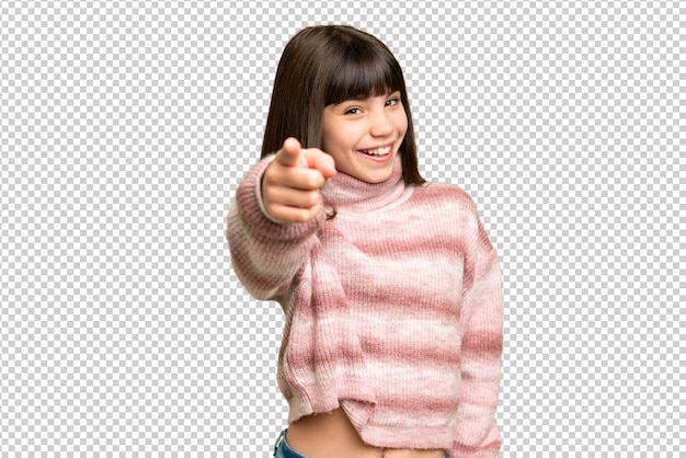 Little girl over isolated green chroma key background pointing front with happy expression