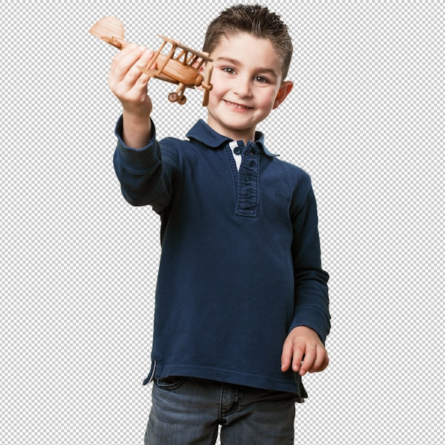 little kid playing with a biplane