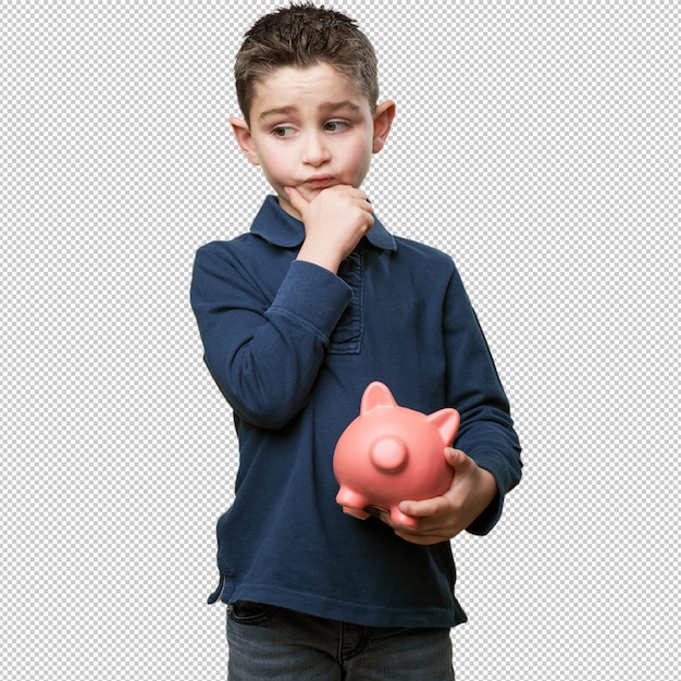little kid thinking with piggy bank