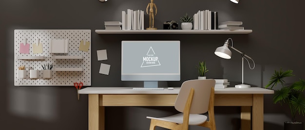 loft working space with computer mockup and supplies