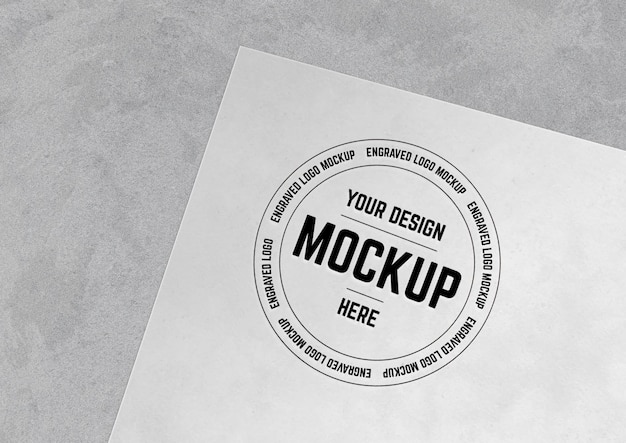 PSD logo engraved over paper surface mockup