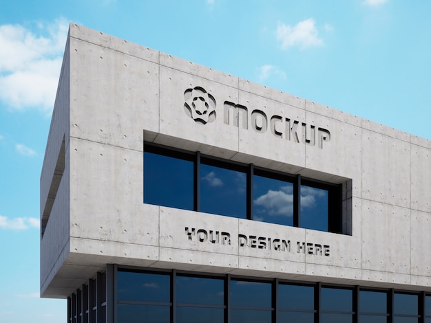 Logo mock-up on concrete building with sky view