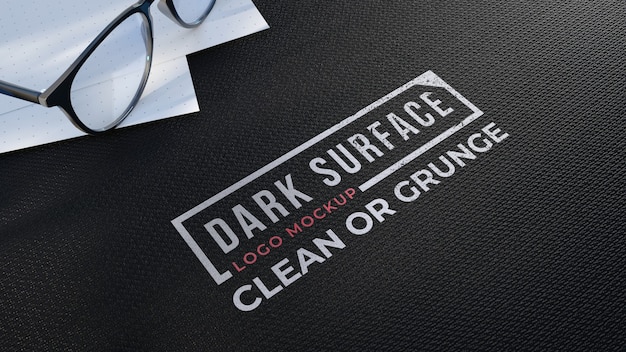 Logo mockup on a black fabric surface