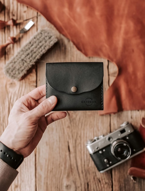 Logo mockup on a black leather wallet