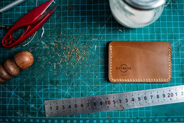 PSD logo mockup on a brown color leather wallet