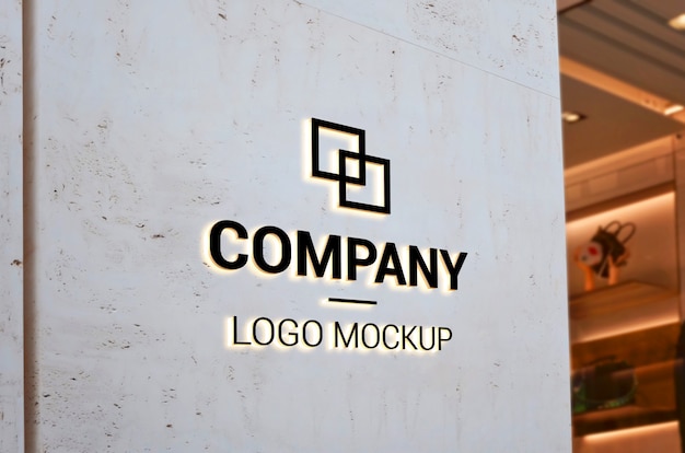 PSD logo mockup on empty entrance wall with light. branding