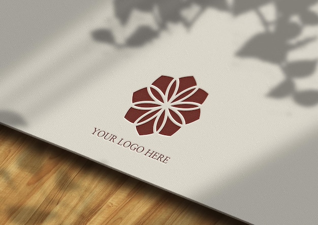 Logo mockup presentation on paper and wooden bacckground