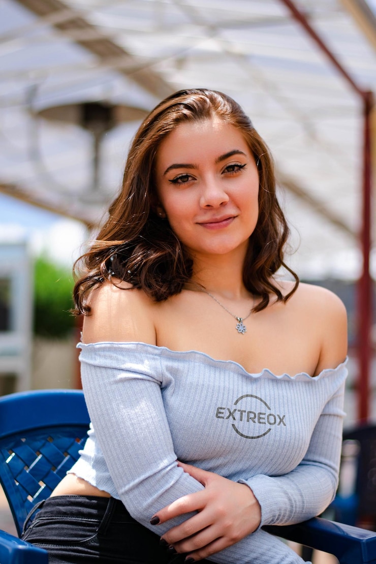 PSD logo mockup on a sky blue tank top