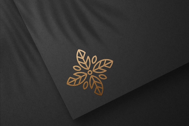 PSD logo mockup with gold foil on black paper textured vol 47