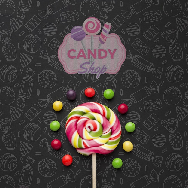 Lollipop with candies on table