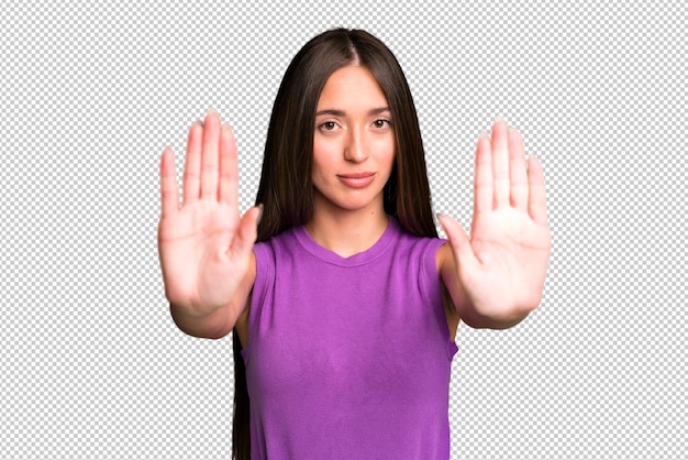 Looking serious unhappy angry and displeased forbidding entry or saying stop with both open palms