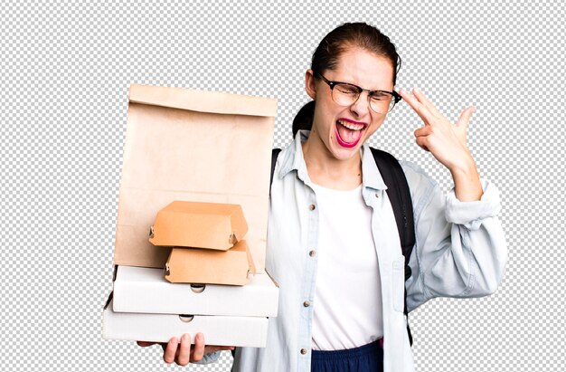 Looking unhappy and stressed suicide gesture making gun sign