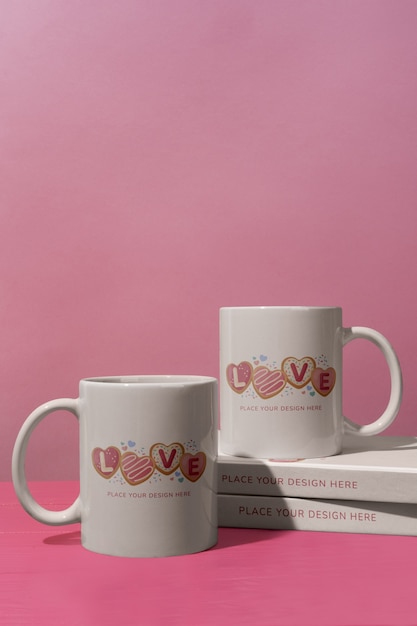 PSD love cups with books on pink background