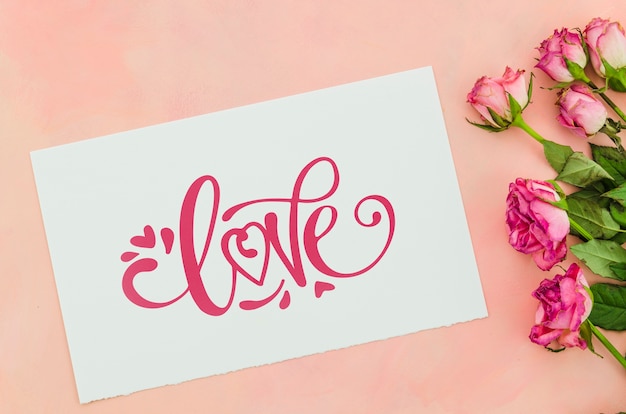 PSD love sheet message with flowers beside