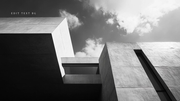 PSD lowangle black and white shot of modern concrete architecture against a cloudy sky