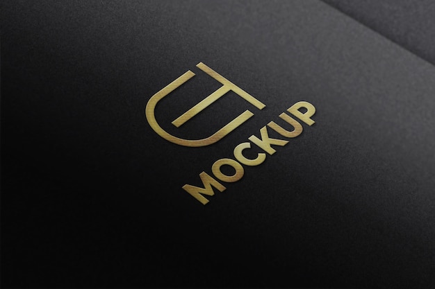 Luxury embossed golden logo mockup on black paper