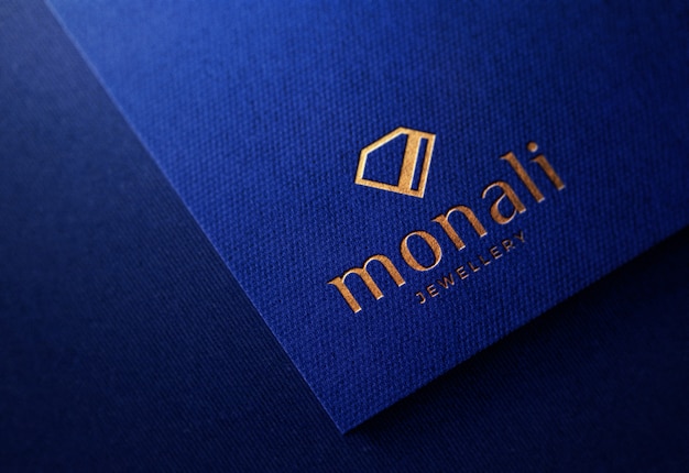 PSD luxury embossed logo mockup on blue paper