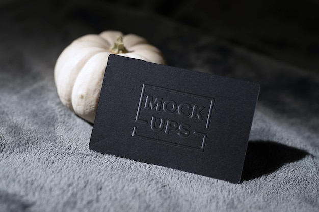 Luxury embossed logo mockup on glossy black business card