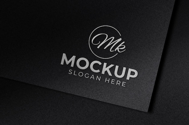 PSD luxury embossed silver logo mockup on black paper