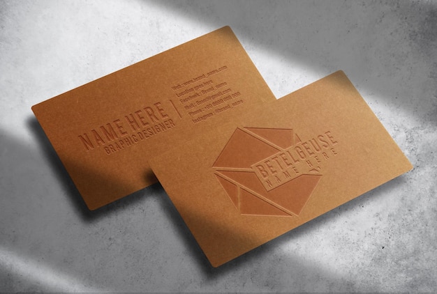 Luxury floating brown paper embossed business card with concrete background mockup