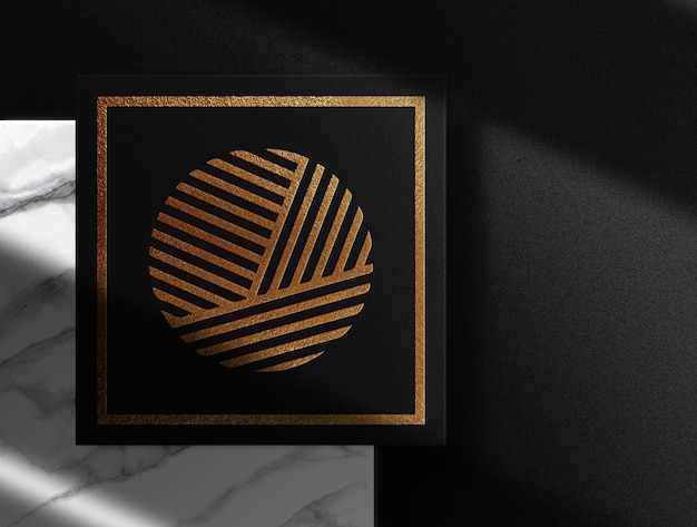 PSD luxury gold embossed black paper top view with marmer podium mockup