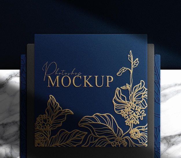 Luxury gold embossed blue paper top view mockup