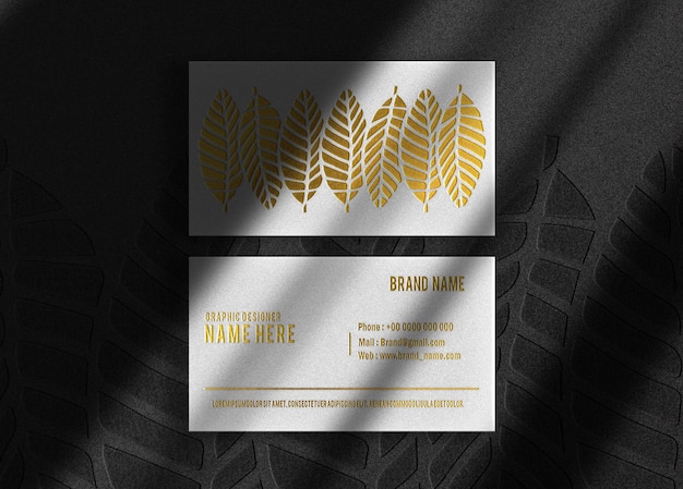 PSD luxury gold embossed business card top view mockup with background embossed